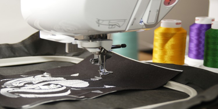 Embroidery machines that creates a white pattern on a black fabric